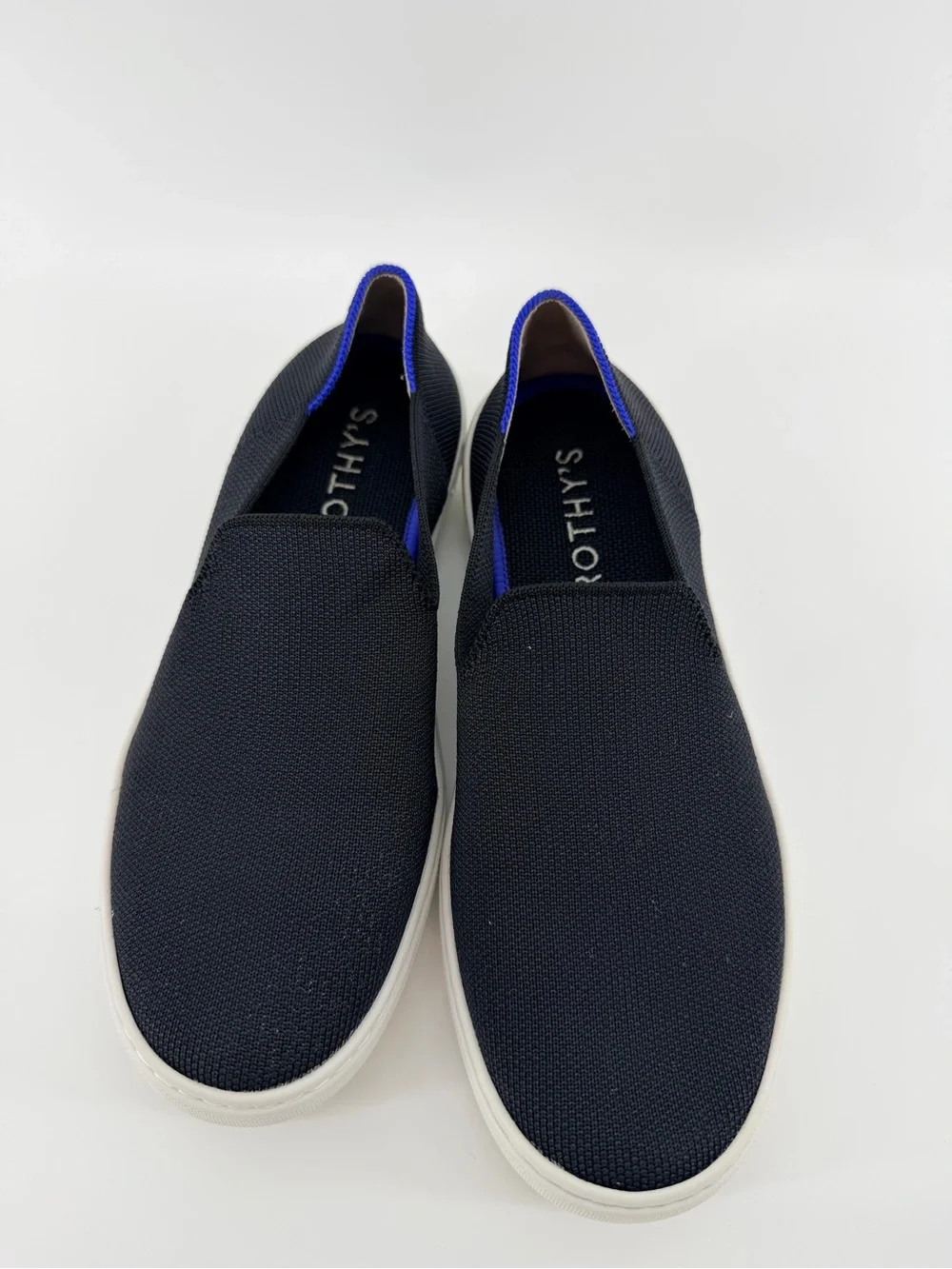 Rothy's Black Knit Original Slip-On Sneakers with Blue & White Heel Tabs
